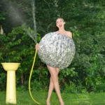 Gigi Hadid Drops Giant Egg Look In Silver Dress for Jacquemus